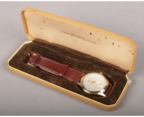 A gents 9ct gold Helvetia manual wristwatch. Presented to W Knight by Longford Midland Concrete.  