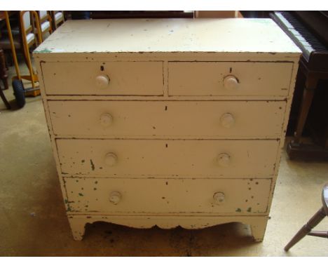 A mid 19th Century white painted pine chest of drawers, with two short and three graduated long drawers, with shaped apron on