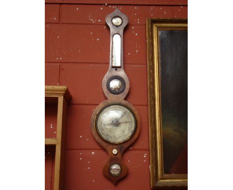 A 19th Century rosewood wheel barometer, with silvered dial, damp/dry scale, thermometer spirit level and convex mirror, sign