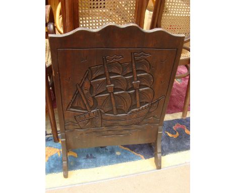 A 1930's oak carved firescreen. 