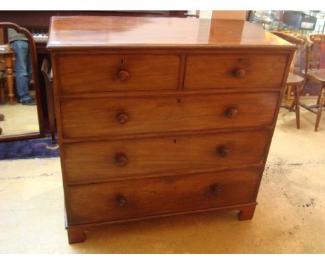 An early Victorian mahogany chest of drawers, with two short and three graduated long drawers with knob handles, raised on br