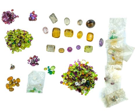 A collection of gemstones. Including garnet doublets, jade, citrines, paste 'gems' etc.