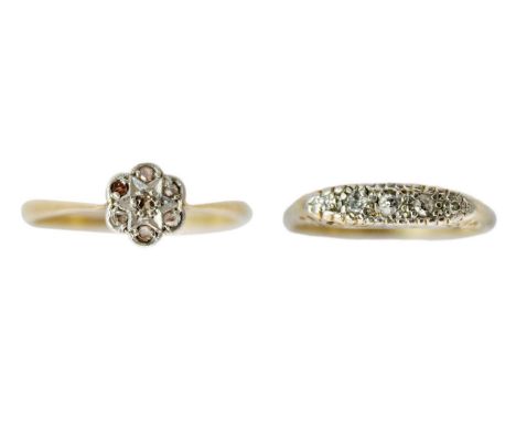 Two 18ct diamond set rings. One is a daisy cluster with seven small stones, size M; the other a five stone ring, size M 1/2, 