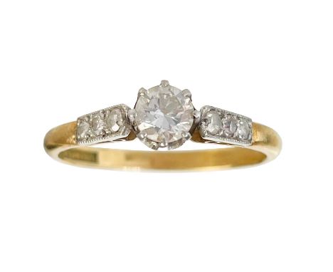 An 18ct and platinum 0.30ct (approximately) diamond solitaire ring. The round brilliant cut diamond in an eight claw setting,