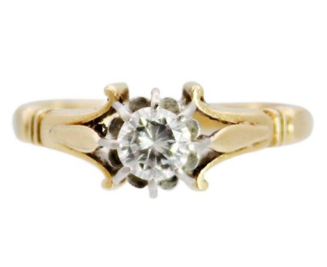 An 18ct and platinum 0.30ct diamond solitaire ring. The round brilliant cut diamond in an eight claw setting, the ring with l