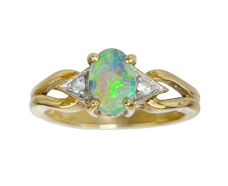 A 9ct blue opal ring by Rocks & Co. The oval opal measuring 7.1 x 5mm, size L, 3g.