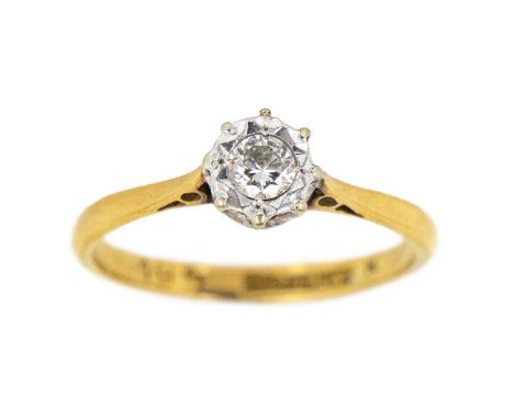 An 18ct & platinum diamond solitaire ring. The 0.10ct diamond in an illusion setting, stamped 18CT&amp;PLAT, size J, 1.94g.