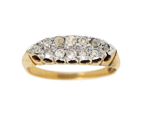 An 18ct diamond set boat-shaped ring. Set with 12 small old-cut diamonds, stamped 18ct, size I 1/2, 2.73g.