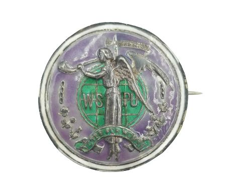 A rare Suffragette 'Angel Of Freedom' brooch. The circular silver green and purple enamel brooch designed by Sylvia Pankhurst