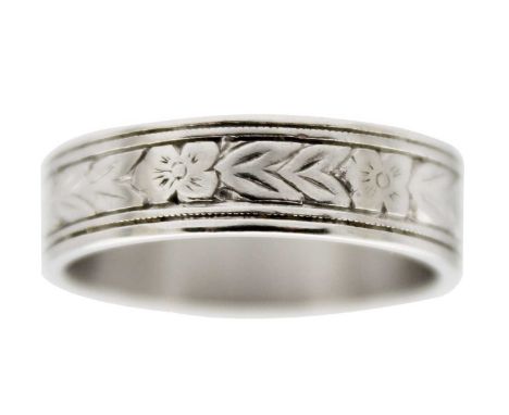 An attractive platinum foliate engraved lady's band ring. Stamped PLAT, size M 1/2, 6.9g.