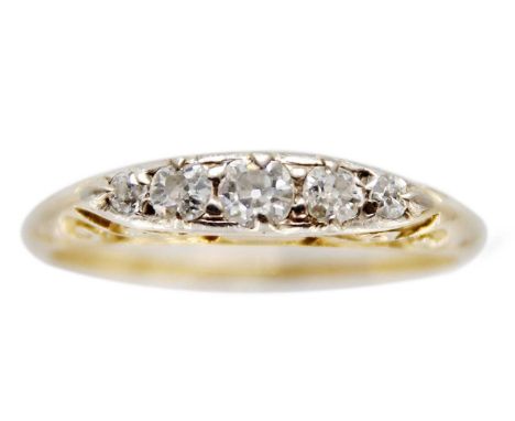 An 18ct diamond set five-stone ring. The principle diamond of 0.10ct approximately, stamped 18c, size L 1/2, 2.3g.