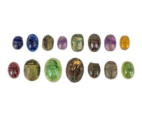 A collection of carved faience and gemstone Egyptian scarab beetles. Three made in opal matrix ironstone, two in amethyst, fo