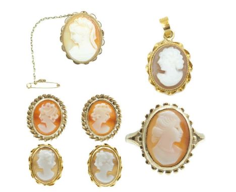 A selection of 9ct shell cameo set jewellery. Comprising a ring, size K 1/2, a brooch, a small pendant and two pairs of stud 
