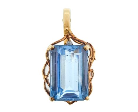 A 14ct blue topaz and diamond set pendant. The rectangular step cut topaz of 10ct estimated weight, with a small 0.001ct roun