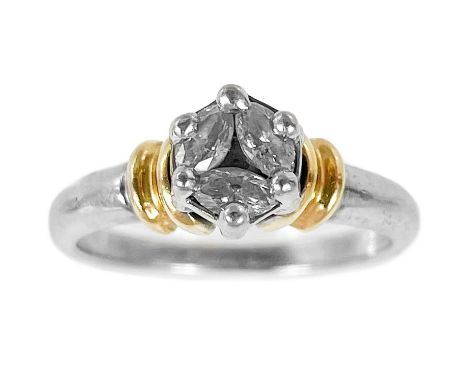 A contemporary 18ct bi-colour diamond set three stone ring. The marquise cut diamonds of 0.25ct approximately claw set into a