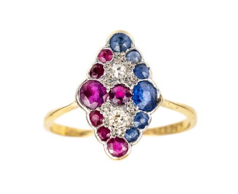 An 18ct and platinum diamond, ruby and sapphire dress ring. The panel head set with twelve round rubies and sapphires and two