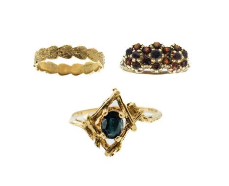 Three 9ct rings.  One is a dress ring set with garnet, size R 1/2, a sapphire set ring in naturalistic setting, size N 1/2, a