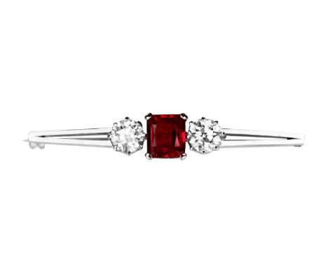 An attractive 1.98ct certified diamond and synthetic ruby set three-stone platinum bar brooch. The diamonds assesed as Old Eu