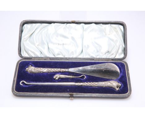 A VICTORIAN SILVER SHOE-HORN SET,&nbsp;by&nbsp;Adie &amp; Lovekin Ltd, Birmingham 1898, comprising shoe-horn with silver hand