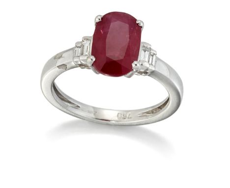 AN 18 CARAT WHITE GOLD RUBY AND DIAMOND RING, an oval-cut ruby between graduated pairs of baguette-cut diamonds, total estima