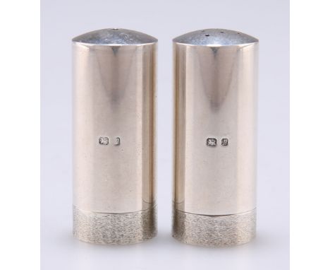 A PAIR OF ELIZABETH II SILVER SALT AND PEPPER POTS,&nbsp;by Stuart Devlin, London 1968 and 1970, cylindrical with slightly do