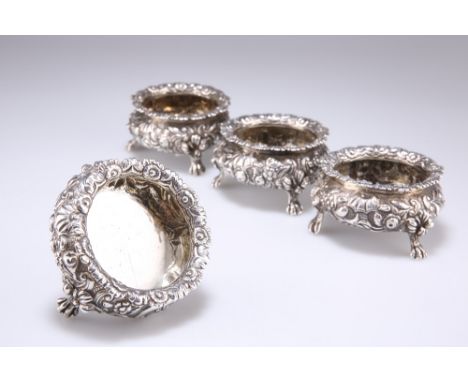 A SET OF FOUR GEORGE IV SILVER SALTS, maker's mark 'IW',&nbsp;London 1821, circular with everted rim, heavily embossed with s