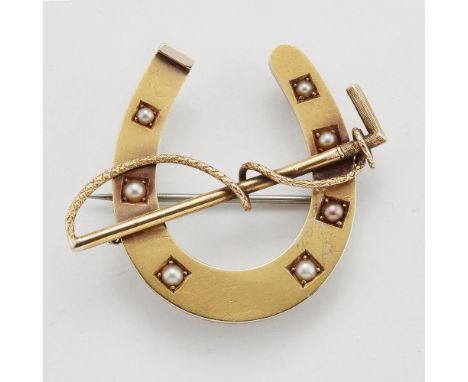A VICTORIAN HORSESHOE AND CROP SPORTING BROOCH, inset with graduated seed pearl 'nails'. 3.7cm by 4.5cm, 8.8 grams&nbsp;CONDI