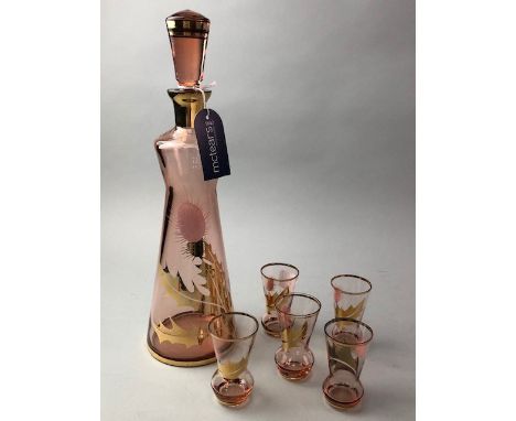 PINK GLASS DECANTER, hand painted with thistles, gilt decoration, with five matching liqueur glasses, along with two coloured