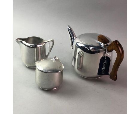 THREE PIECE PICQUOT WARE TEA SERVICE, comprising tea pot, sugar and cream, along with a pair of bookends, a trinket box and b