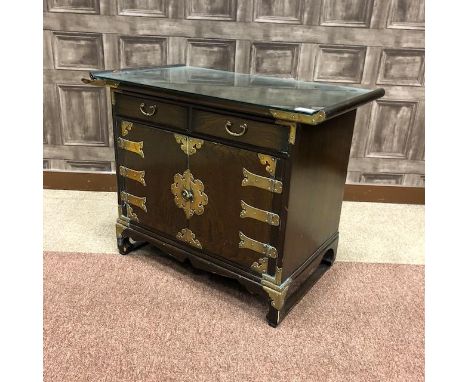 20TH CENTURY CHINESE STAINED OAK CABINET, the rectangular top with scroll ends over two drawers and two cupboard doors, with 