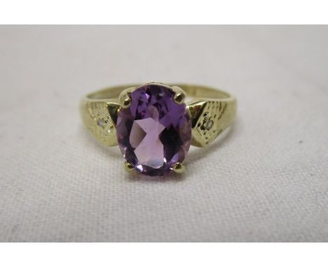 Gold oval natural amethyst &amp; diamond ring