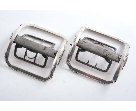 A PAIR OF GEORGE III LARGE MOUNTED STEEL SHOE BUCKLES with narrow, canted rectangular borders, lightly adorned with repeating