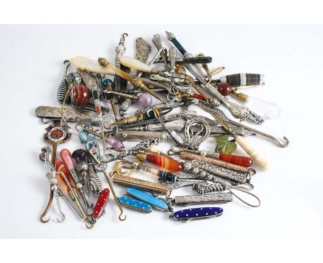 BUTTON HOOKS A collection of approximately seventy hooks for gloves, including a 9 ct. gold example, Birmingham 1885, silver 