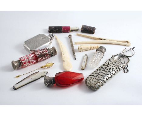 A MIXED LOT: Two mounted red glass scent bottles, two ivory items, a bone item, three various folding fruit knives with mothe