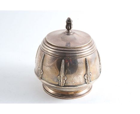 A MODERN CIRCULAR BISCUIT BOX OR TEA CADDY with a rising cover, bud finial & applied straps around the body, maker's mark unc