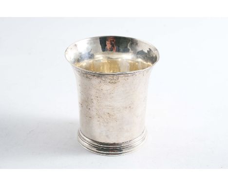 A GEORGE II BEAKER with a plain body, a skirted base, inscribed "T. ASHWORTH" underneath, and a flared rim, no apparent maker