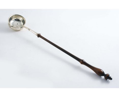 A GEORGE II PUNCH LADLE with a circular bowl, lip spout and a turned hardwood handle, by Richard Gosling, London c.1740;  16.
