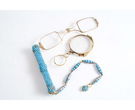 A GOLD LORGNETTE The case and chain studded with turquoise and with heart shape pendant, 21 cms overall, together with a gold