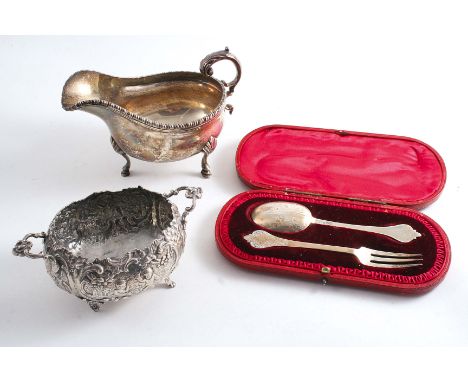 A MIXED LOT: A sauce boat by Carrington & Co., Birmingham 1922, a Continental decorative bonbon dish with English import mark