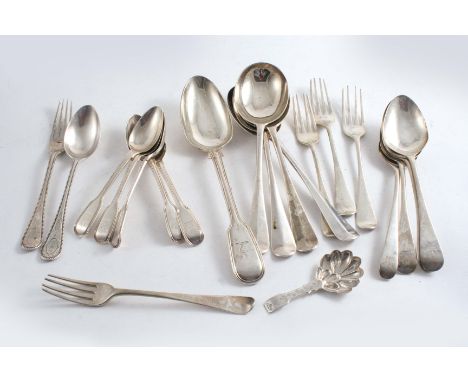 A MIXED LOT OF FLATWARE:- An early Victorian caddy spoon,  four modern Rattail pattern soup spoons,  a table spoon, four dess