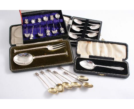 A MIXED LOT:- A small spoon, initialled & cased, a cased set of six coffee spoons, a cased set of six small Eastern spoons, a