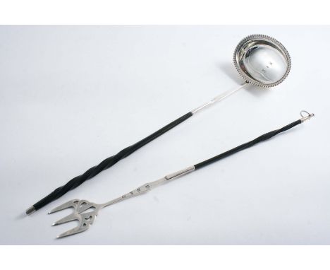 A GEORGE IV / WILLIAM IV PUNCH LADLE with an oval bowl, a decorative border and a twisted whalebone handle, by William Knight