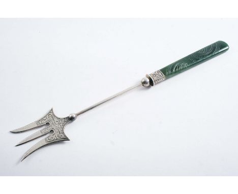 AN EARLY 20TH CENTURY NEW ZEALAND BREAD FORK with engraved tines and a carved dark green jade handle by E. Souness of Dunedin