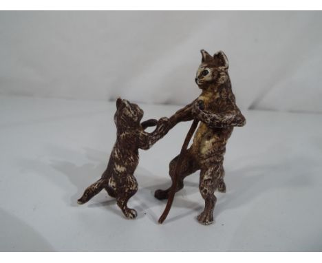 A cold cast painted bronze statue depicting cats in the style of a Burgman. Estimate £60 - £80