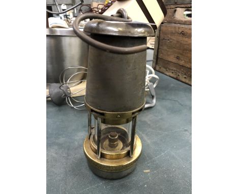 A VINTAGE BRASS 'THE WOLF' SAFETY MINERS LAMP 