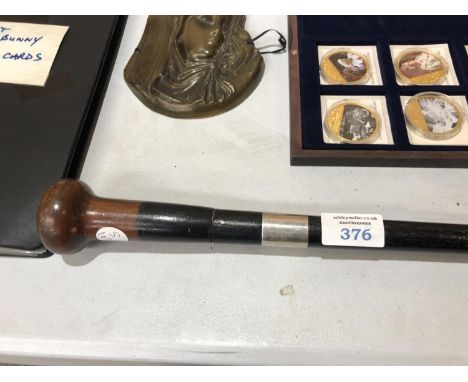 A VINTAGE WALKING STICK WITH AN UNMARKED, PROBABLY SILVER, FERRULE 