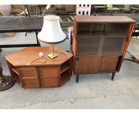 A TEAK TV CABINET, A TEAK CABINET WITH FOUR SLIDING DOORS AND A BRASS TABLE LAMP 