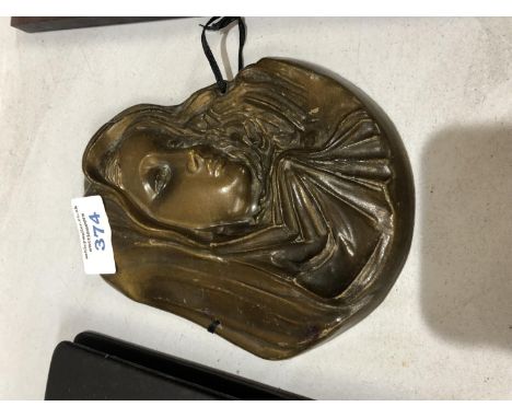 AN ART NOUVEAU STYLE METAL PLAQUE OF A WOMAN 