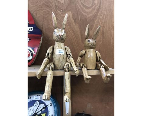 TWO WOODEN DECORATIVE SHELF PUPPETS 