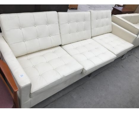 A MODERN CREAM LEATHER THREE SEATER SOFA ON SQUARE CHROME SUPPORTS 227 CM X 79 CM X 58 CM HIGH 